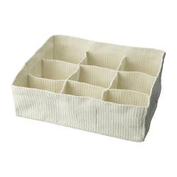Another great Ikea item...store rolled up scarves, belts, or other small items in the compartments.
